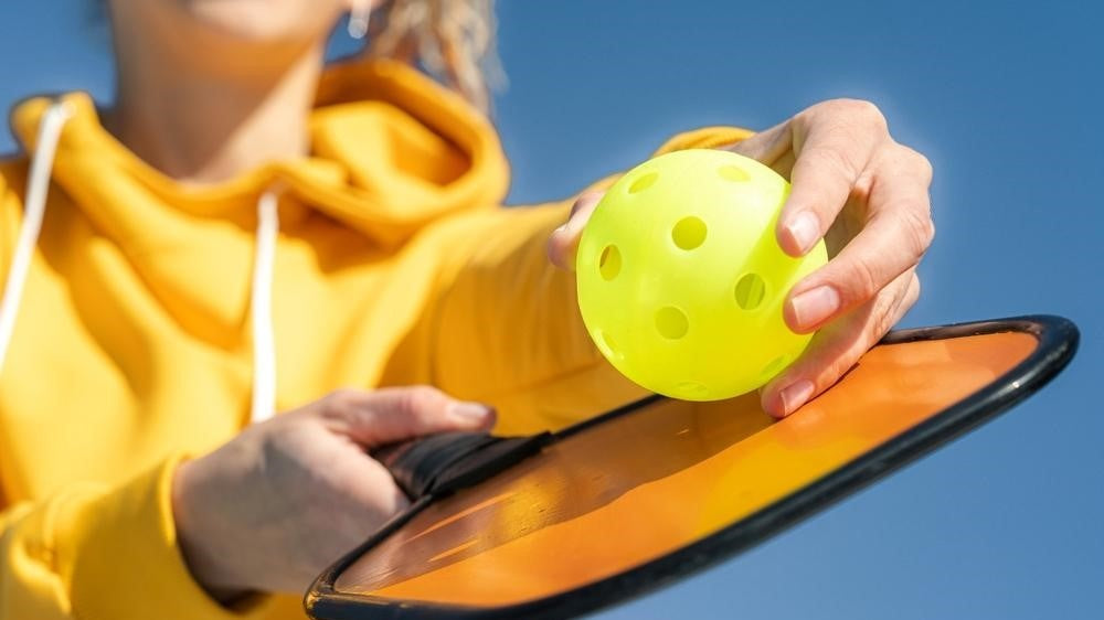 women ready to serve pickleball