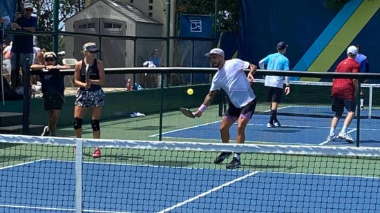 Tyson McGuffin and Anna Leigh Waters playing mixed doubles pickleball - winners and improved competition